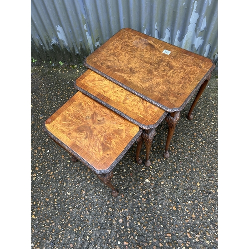 262 - A walnut nest of three occasional tables