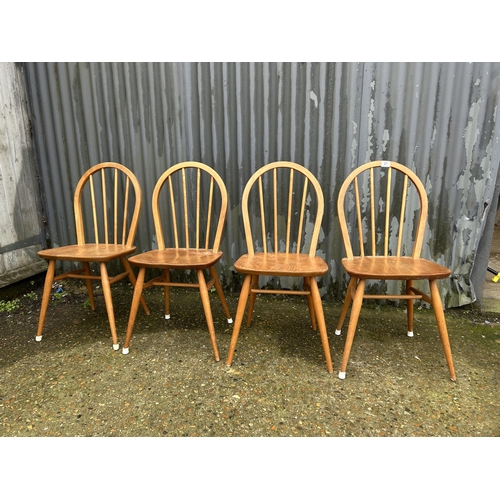 27 - A set of four ercol light elm chairs