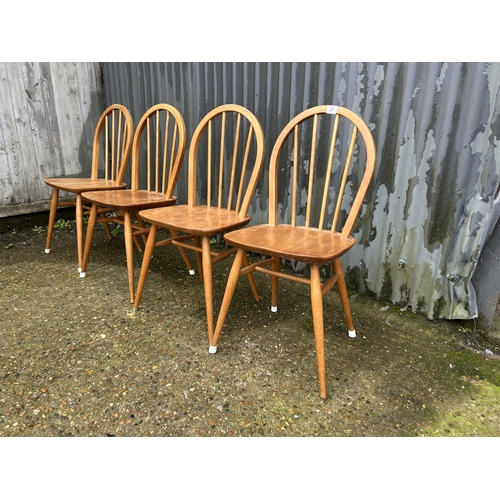 27 - A set of four ercol light elm chairs