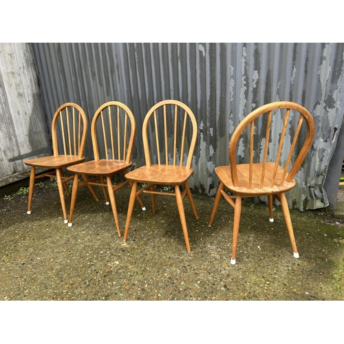 27 - A set of four ercol light elm chairs