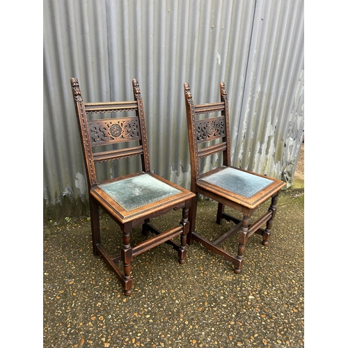 271 - A pair of carved oak chairs