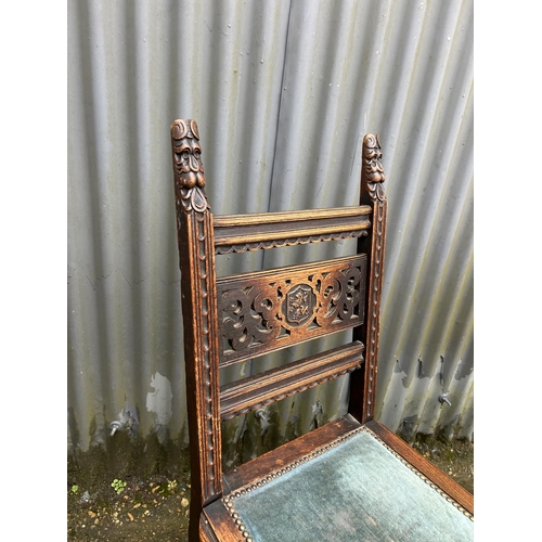 271 - A pair of carved oak chairs