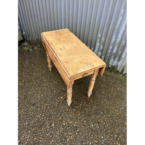 278 - A pine drop leaf kitchen table with drawer