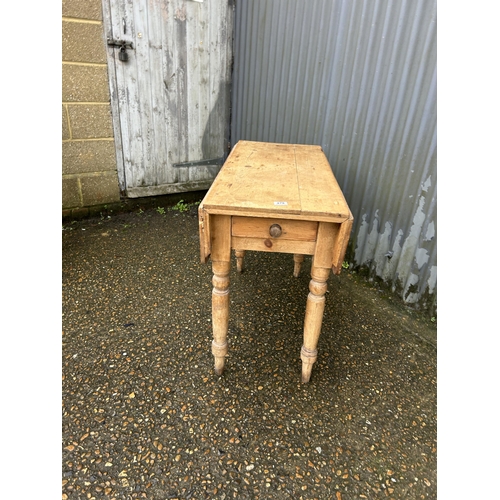 278 - A pine drop leaf kitchen table with drawer