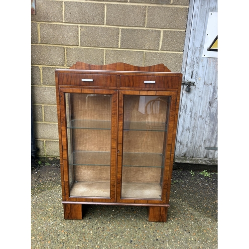 28 - An art deco display cabinet with two drawers and two glazed shelves 88x30x130