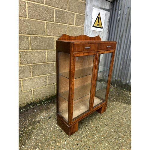 28 - An art deco display cabinet with two drawers and two glazed shelves 88x30x130