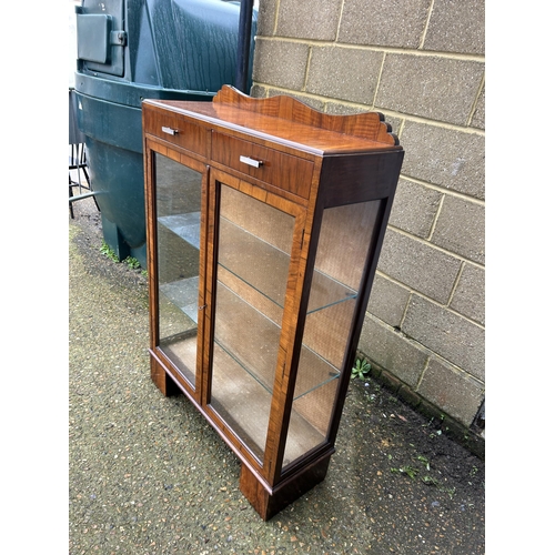 28 - An art deco display cabinet with two drawers and two glazed shelves 88x30x130