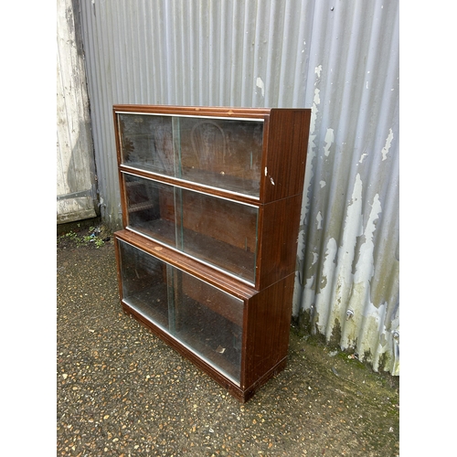 282 - A glazed three section stacking bookcase 90x23x110