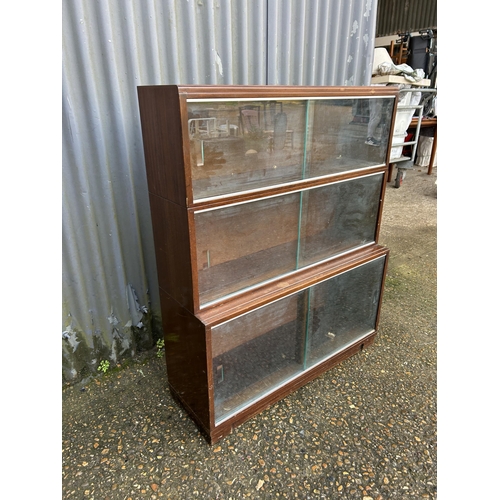 282 - A glazed three section stacking bookcase 90x23x110