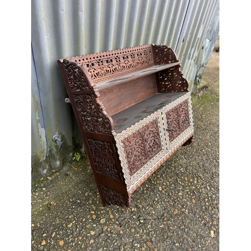 284 - An unusual Indian carved and inlaid wall cabinet 60 w x 66 h x 20 cms d