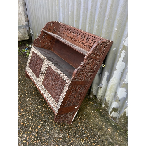 284 - An unusual Indian carved and inlaid wall cabinet 60 w x 66 h x 20 cms d