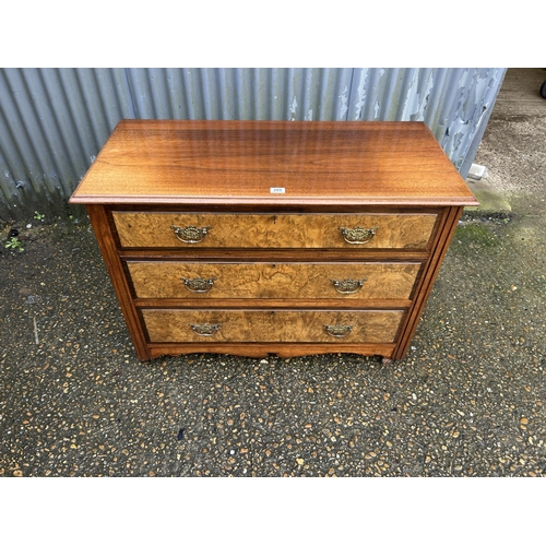 285 - An Edwardian mahogany and walnut chest of three drawers 105x50x77