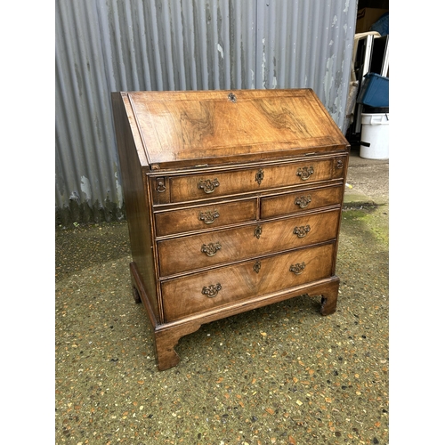 30 - A Georgian walnut bureau with fitted interior 77cm wide