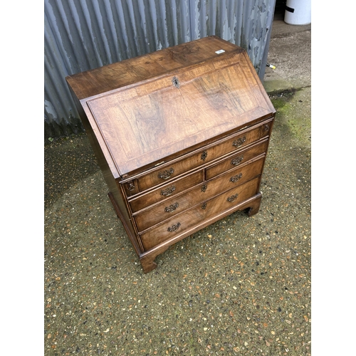 30 - A Georgian walnut bureau with fitted interior 77cm wide