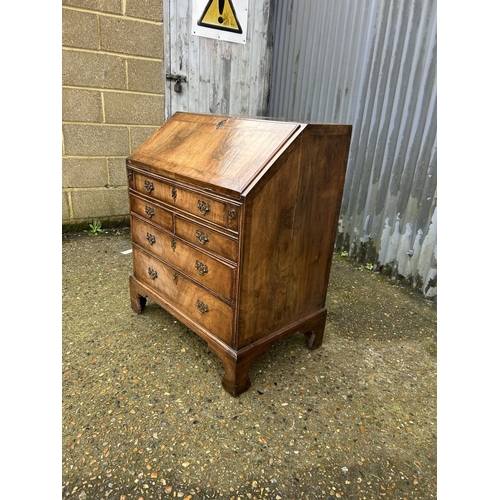 30 - A Georgian walnut bureau with fitted interior 77cm wide