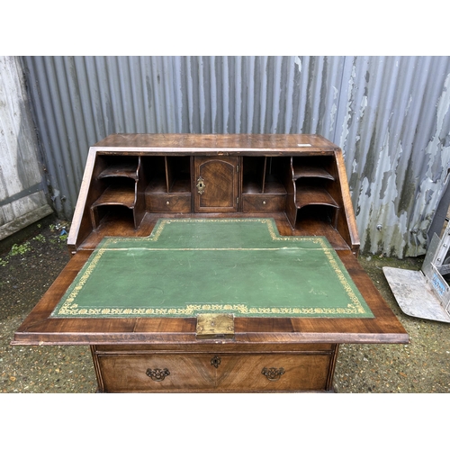 30 - A Georgian walnut bureau with fitted interior 77cm wide