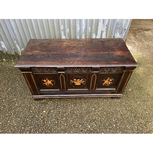 305 - An antique oak blanket box chest inlaid to the front