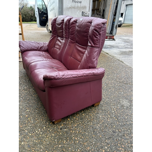 311 - A EKORNES stressless maroon leather two seater sofa