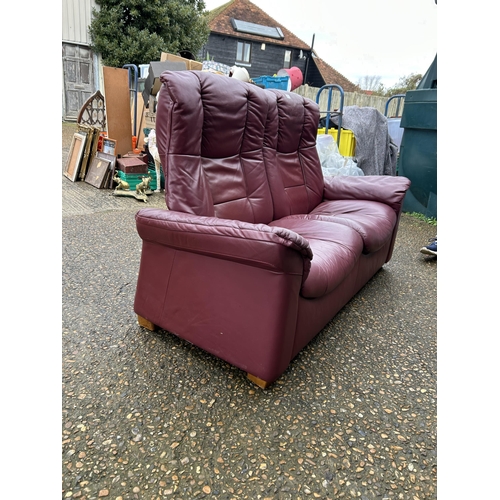 311 - A EKORNES stressless maroon leather two seater sofa