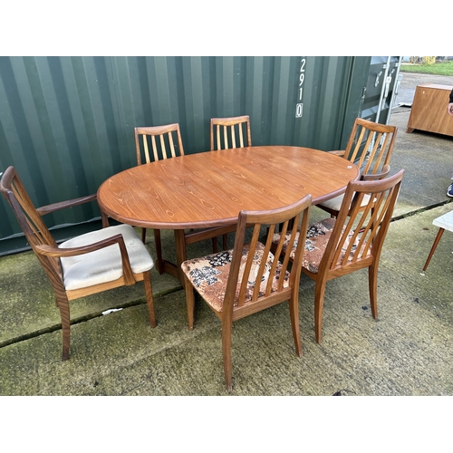 317 - A g plan teak extending dining table together with six chairs