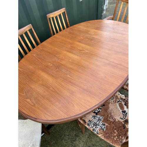 317 - A g plan teak extending dining table together with six chairs