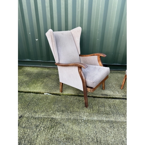 320 - A pair of mid century Parker knoll or similar wing back chairs