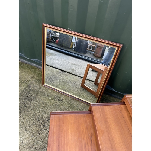 321 - A tile top teak nest of three tables together with a teak framed mirror