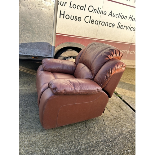 325 - A good quality modern brown leather reclining armchair with footrest