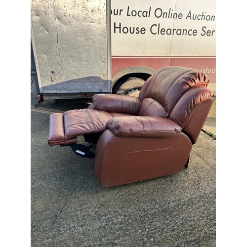 325 - A good quality modern brown leather reclining armchair with footrest