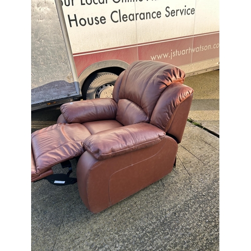 325 - A good quality modern brown leather reclining armchair with footrest