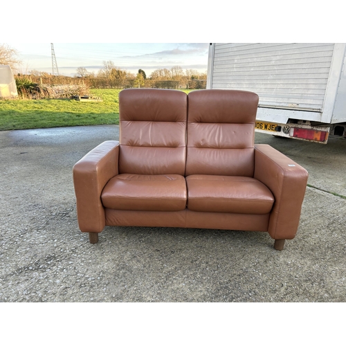 334 - An ekornes stressless brown leather two seater reclining sofa