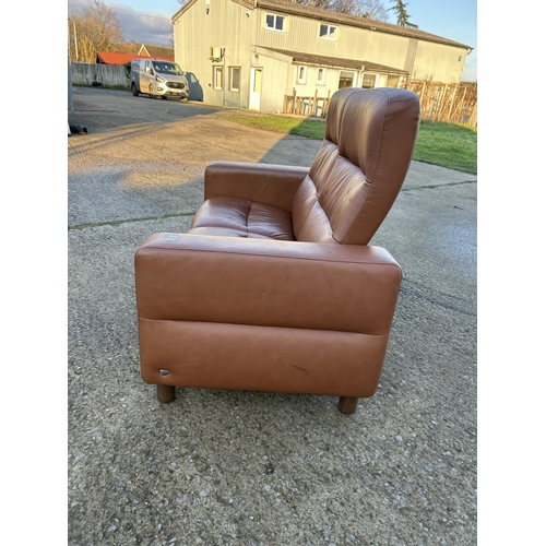 334 - An ekornes stressless brown leather two seater reclining sofa