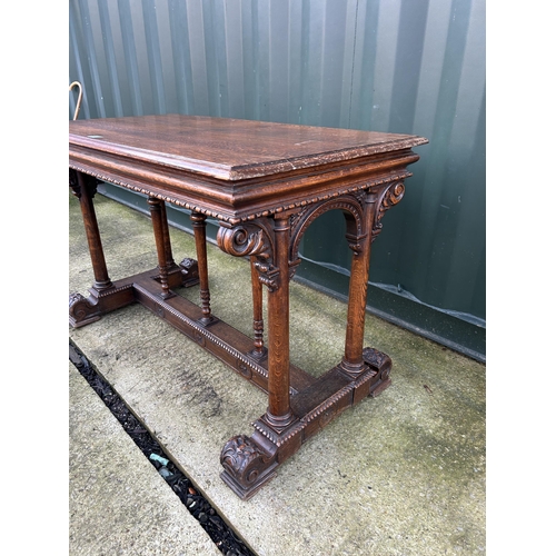 335 - A carved oak centre table 112x60x75