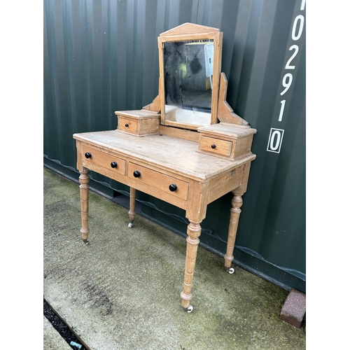 337 - A country pine two drawer dressing table