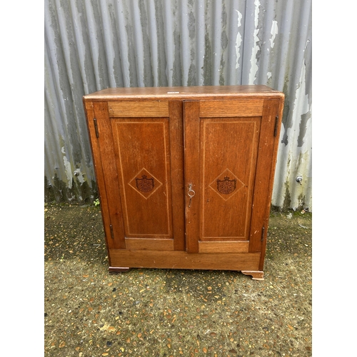 34 - A mahogany two door humidor cupboard  65 x 26x 70