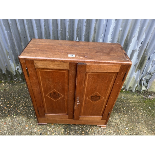 34 - A mahogany two door humidor cupboard  65 x 26x 70