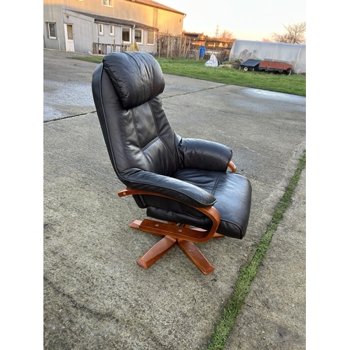 340 - A brown leather swivel armchair