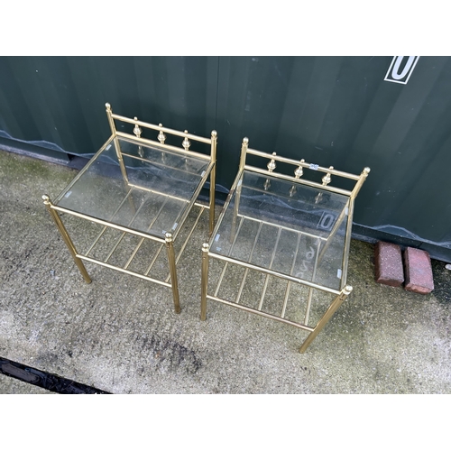 344 - A pair of brass bedside tables with drop in glass tops