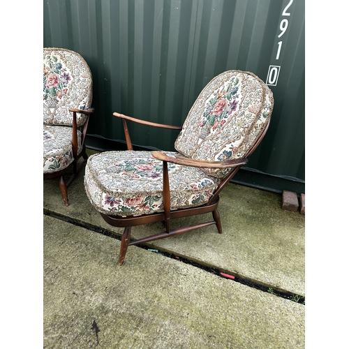 349 - A pair of ercol dark elm armchairs