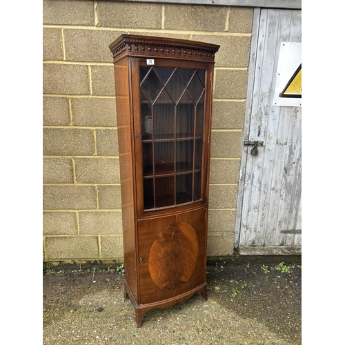 35 - A reproduction mahogany bow front cabinet by BEVAN AND FUNNELL  60x30x180