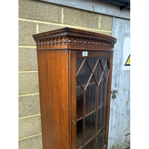 35 - A reproduction mahogany bow front cabinet by BEVAN AND FUNNELL  60x30x180