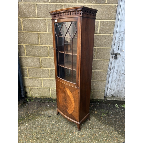 35 - A reproduction mahogany bow front cabinet by BEVAN AND FUNNELL  60x30x180