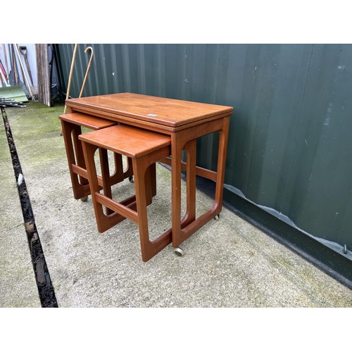 365 - A mid century mcintosh teak nest of three tables with fold over top