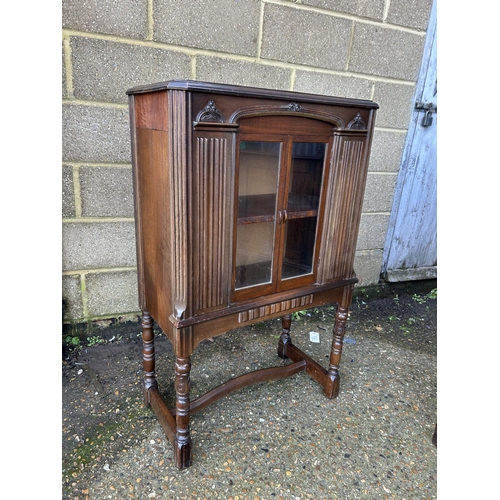 37 - A mahogany glazed two door cabinet  70x35 x110