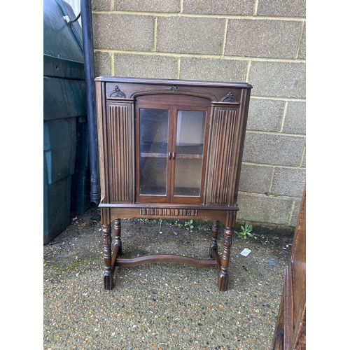 37 - A mahogany glazed two door cabinet  70x35 x110