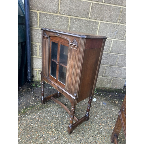 37 - A mahogany glazed two door cabinet  70x35 x110