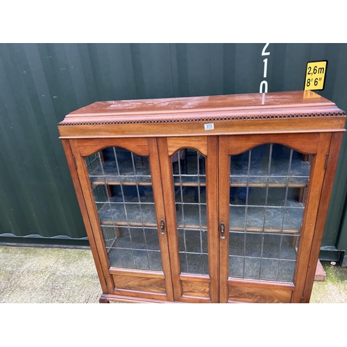 373 - An Edwardian mahogany display cabinet with leaded glass doors  134x37x130