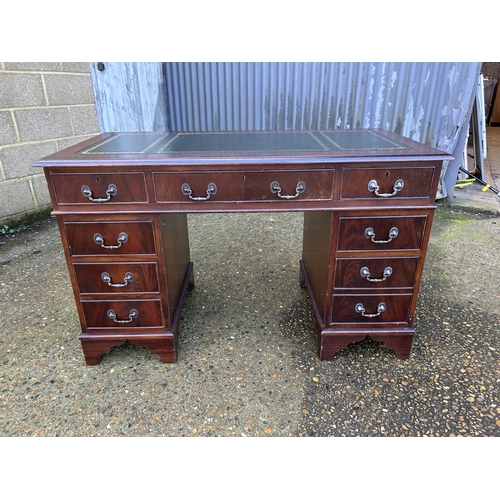 38 - A reproduction mahogany twin pedestal desk 4ft x2ft