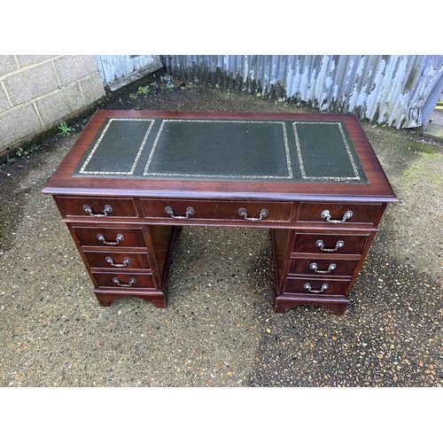 38 - A reproduction mahogany twin pedestal desk 4ft x2ft