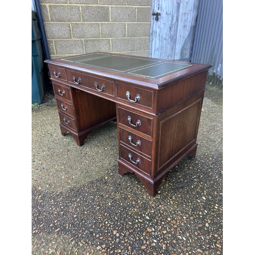 38 - A reproduction mahogany twin pedestal desk 4ft x2ft